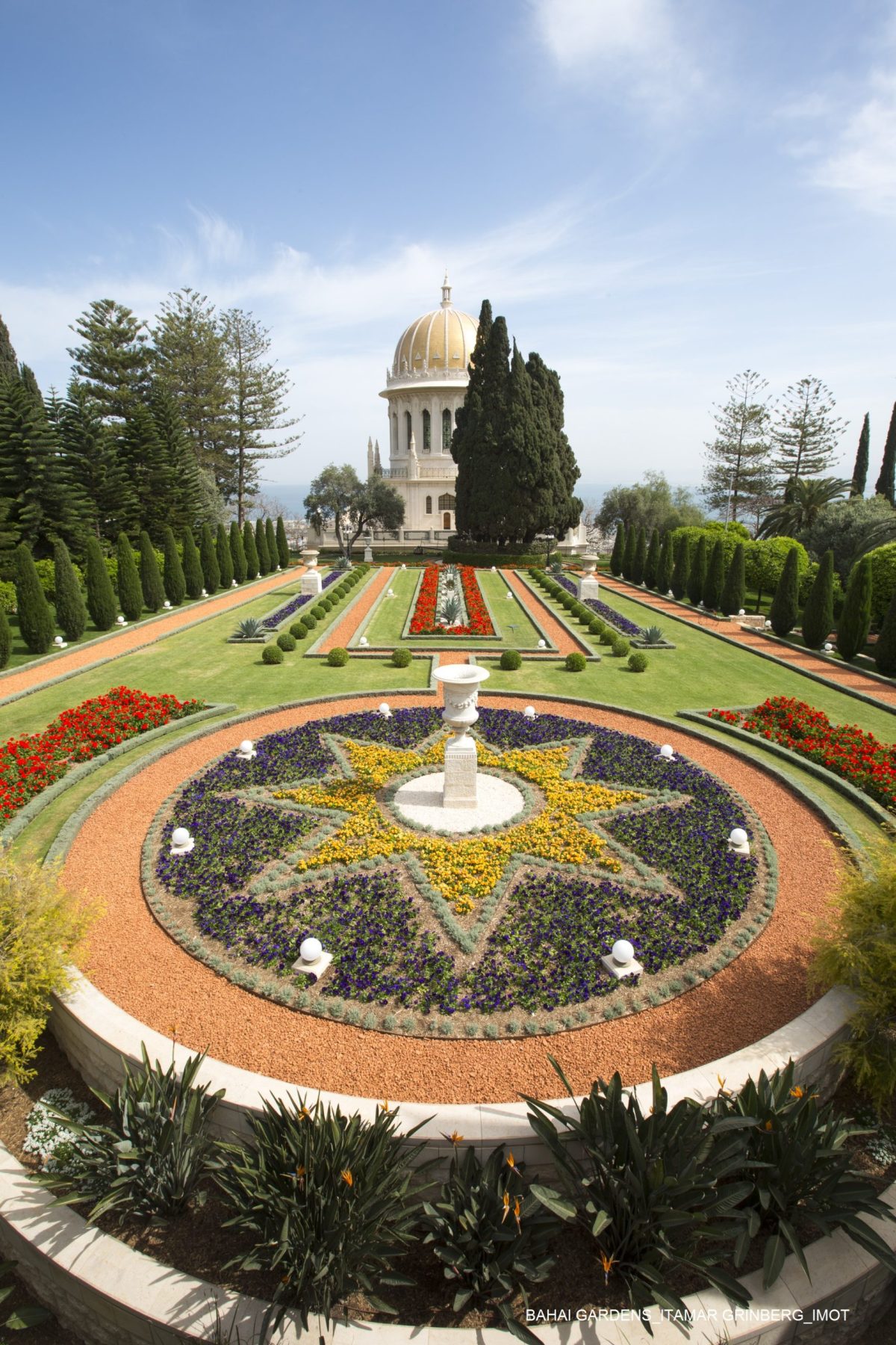 The Bahá'í Faith is a monotheistic religion founded by Bahá'u'lláh in 19th-century Persia, emphasizing the spiritual unity of all humankind. There are an estimated five to six million Bahá'ís around the world in more than 200 countries and territories.The spiritual center of the faith is in Haifa and the grave of the founder of the faith is in Acre. The Bahai Center in Haifa is a UNESCO World Heritage Site. The picture shows the gardens and temple of the Bahai in Haifa on the slopes of Mount Carmel. Photo by Itamar Grinberg.